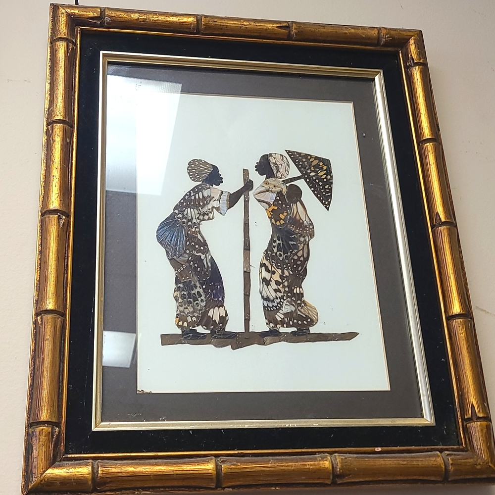 Real Butterflies wings frame of two women with beautiful golden frame ha…
